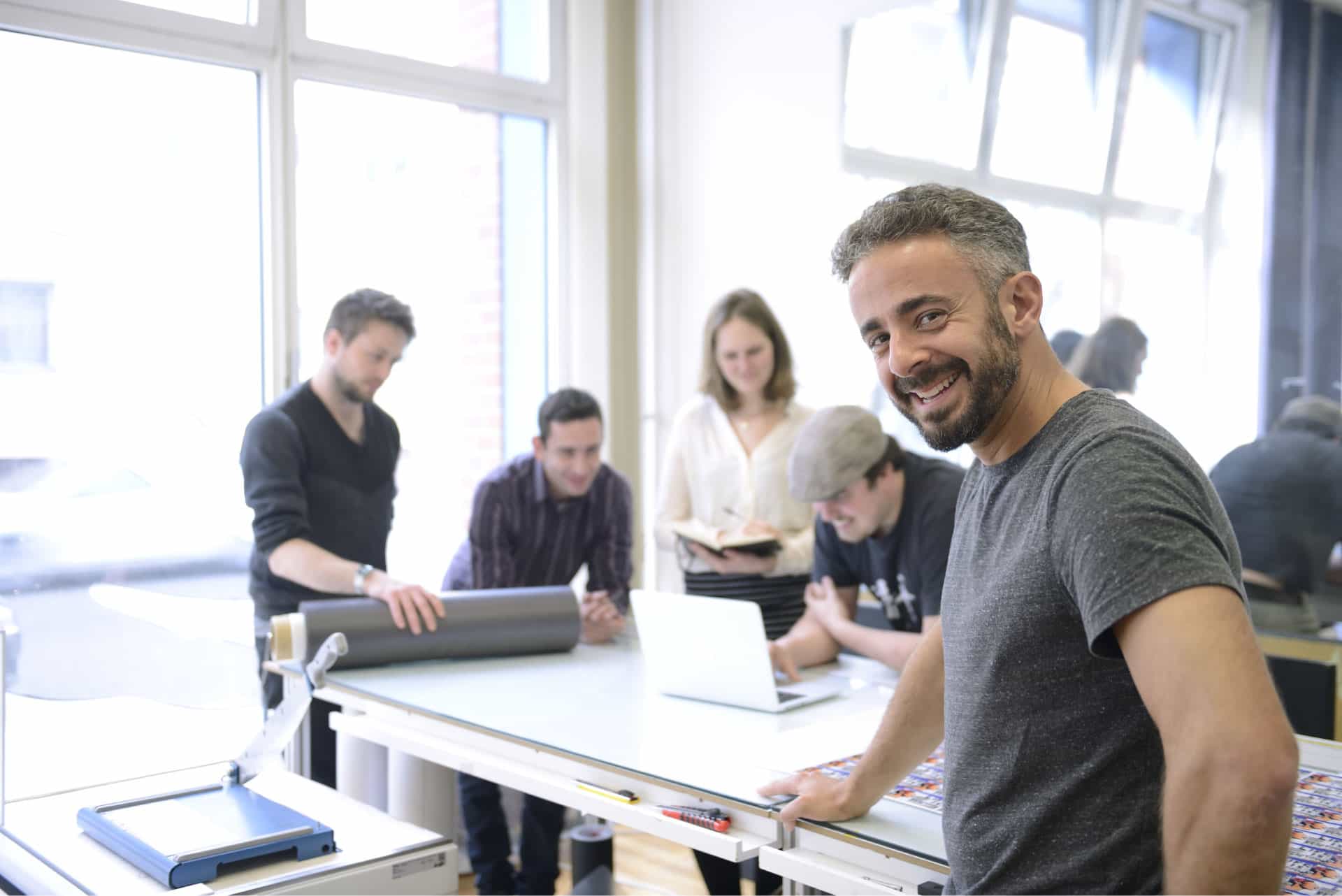 Team of professionals collaborating in a bright studio office