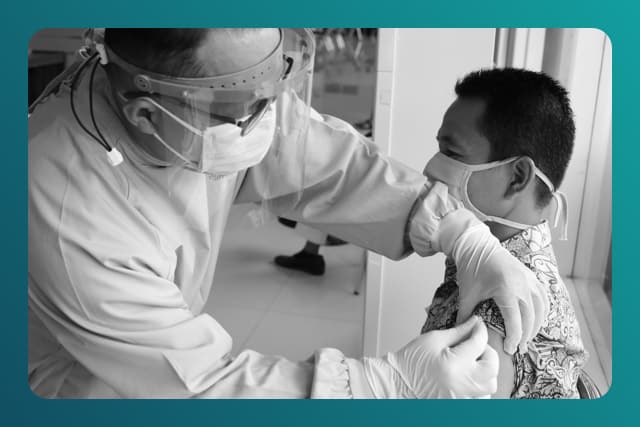 medical worker giving patient a shot