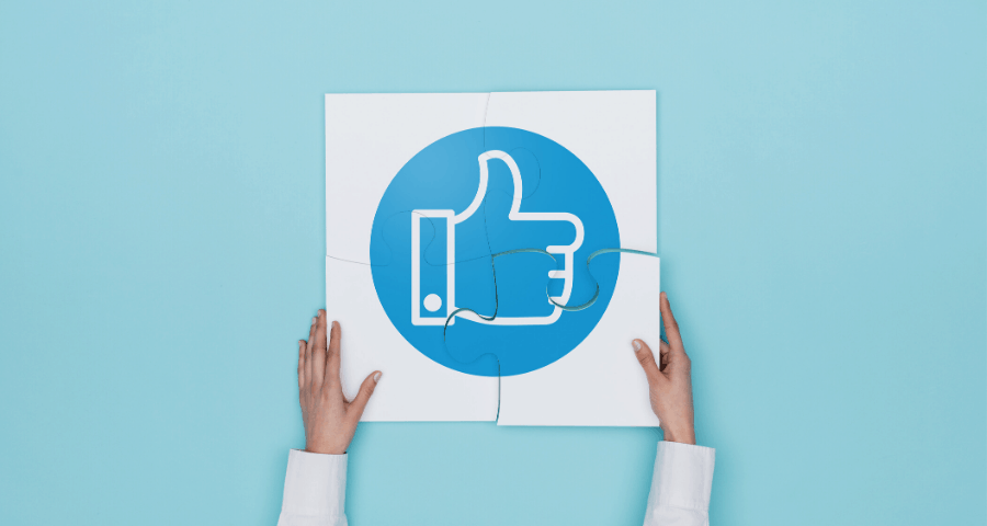 Social media marketing strategy- Person holding up a 'like' sign