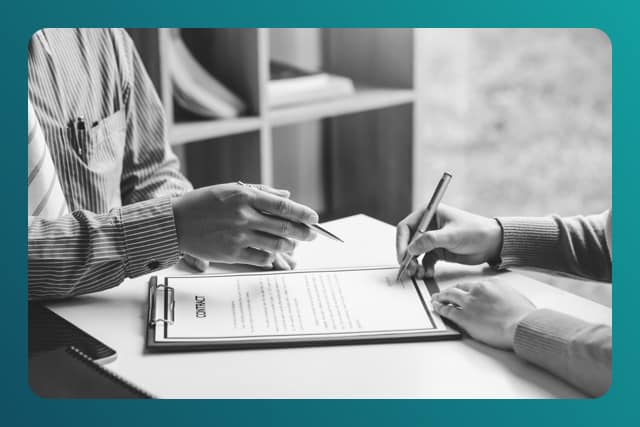 Two people looking over a contract at a law firm