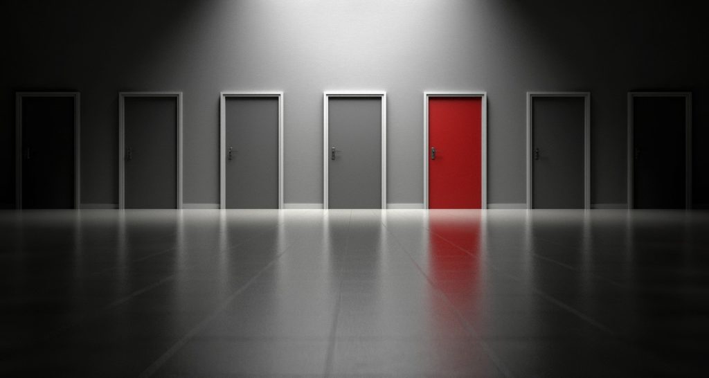 quickbooks capital alternatives; wall full of grey doors with one red door